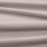 Tessuto Linara di Romo nella colorazione Zinc drappeggiato, per mostrarne la caduta e la finitura spazzolata.