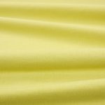 Tessuto Linara di Romo nella colorazione Zest drappeggiato, per mostrarne la caduta e la finitura spazzolata.