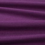 Tessuto Linara di Romo nella colorazione Crocus drappeggiato, per mostrarne la caduta e la finitura spazzolata.