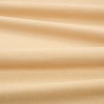 Tessuto Linara di Romo nella colorazione Honeycomb drappeggiato, per mostrarne la caduta e la finitura spazzolata.