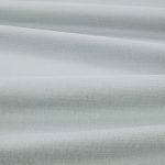 Tessuto Linara di Romo nella colorazione Swedish Grey drappeggiato, per mostrarne la caduta e la finitura spazzolata.