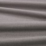 Tessuto Linara di Romo nella colorazione Magnesium drappeggiato, per mostrarne la caduta e la finitura spazzolata.