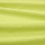 Tessuto Linara di Romo nella colorazione Chartreuse drappeggiato, per mostrarne la caduta e la finitura spazzolata.
