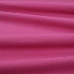 Tessuto Linara di Romo nella colorazione Magenta drappeggiato, per mostrarne la caduta e la finitura spazzolata.
