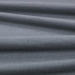 Tessuto Linara di Romo nella colorazione Gunmetal drappeggiato, per mostrarne la caduta e la finitura spazzolata.