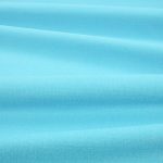 Tessuto Linara di Romo nella colorazione Argon drappeggiato, per mostrarne la caduta e la finitura spazzolata.