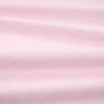 Tessuto Linara di Romo nella colorazione Rosewater drappeggiato, per mostrarne la caduta e la finitura spazzolata.