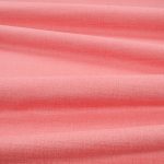 Tessuto Linara di Romo nella colorazione Pomelo drappeggiato, per mostrarne la caduta e la finitura spazzolata.