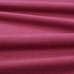 Tessuto Linara di Romo nella colorazione Cyclamen drappeggiato, per mostrarne la caduta e la finitura spazzolata.