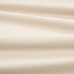 Tessuto Linara di Romo nella colorazione Briosca drappeggiato, per mostrarne la caduta e la finitura spazzolata.