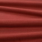 Tessuto Linara di Romo nella colorazione Chutney drappeggiato, per mostrarne la caduta e la finitura spazzolata.
