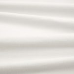 Tessuto Linara di Romo nella colorazione Brume drappeggiato, per mostrarne la caduta e la finitura spazzolata.