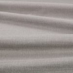 Tessuto Linara di Romo nella colorazione Sandpiper drappeggiato, per mostrarne la caduta e la finitura spazzolata.