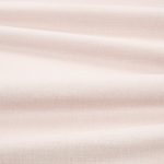 Tessuto Linara di Romo nella colorazione Plaster drappeggiato, per mostrarne la caduta e la finitura spazzolata.