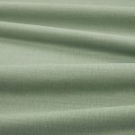 Tessuto Linara di Romo nella colorazione Dill drappeggiato, per mostrarne la caduta e la finitura spazzolata.