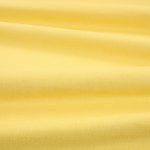 Tessuto Linara di Romo nella colorazione Soleil drappeggiato, per mostrarne la caduta e la finitura spazzolata.