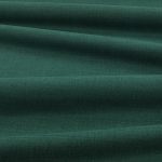 Tessuto Linara di Romo nella colorazione Bonsai drappeggiato, per mostrarne la caduta e la finitura spazzolata.