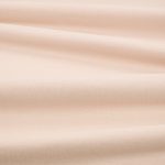 Tessuto Linara di Romo nella colorazione Hoya drappeggiato, per mostrarne la caduta e la finitura spazzolata.