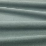 Tessuto Linara di Romo nella colorazione Adriatic drappeggiato, per mostrarne la caduta e la finitura spazzolata.