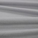 Tessuto Linara di Romo nella colorazione Pietra drappeggiato, per mostrarne la caduta e la finitura spazzolata.