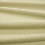 Tessuto Linara di Romo nella colorazione Pistachio drappeggiato, per mostrarne la caduta e la finitura spazzolata.