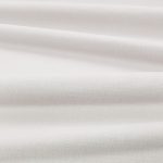 Tessuto Linara di Romo nella colorazione Silver drappeggiato, per mostrarne la caduta e la finitura spazzolata.
