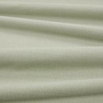 Tessuto Linara di Romo nella colorazione Lemongrass drappeggiato, per mostrarne la caduta e la finitura spazzolata.