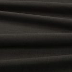Tessuto Linara di Romo nella colorazione Espresso drappeggiato, per mostrarne la caduta e la finitura spazzolata.