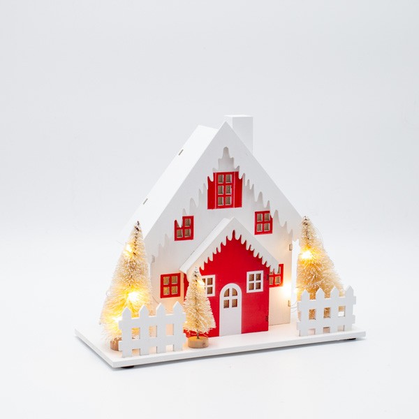 Casetta di Natale luminosa in legno con alberi e tetto innevato, fotografia del produttore: gli altri oggetti eventualmente presenti nella scena non sono compresi