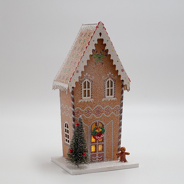 Casetta di Natale luminosa in carta beige con biscotto di pan di zenzero, fotografia del produttore: gli altri oggetti eventualmente presenti nella scena non sono compresi