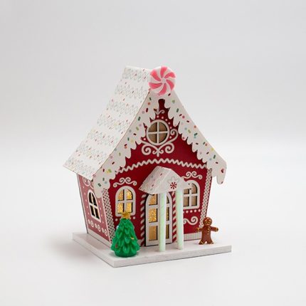 Casetta di Natale luminosa in carta rossa con biscotto di pan di zenzero, fotografia del produttore: gli altri oggetti eventualmente presenti nella scena non sono compresi