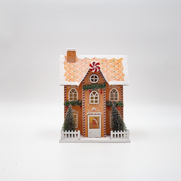 Casetta di Natale luminosa in carta beige con caramelle, fotografia del produttore: gli altri oggetti eventualmente presenti nella scena non sono compresi