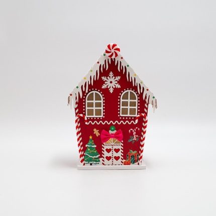 Casetta di Natale luminosa in carta rossa con caramelle, fotografia del produttore: gli altri oggetti eventualmente presenti nella scena non sono compresi