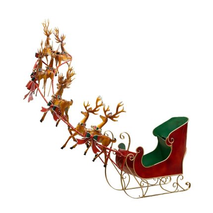 Slitta di Babbo Natale in metallo con renne, rossa e verde, fotografia su fondo bianco
