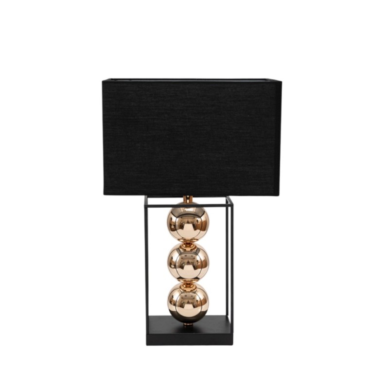 Lampada da tavolo con base e telaio rettangolare in metallo nero, tre sfere dorate impilate al centro e paralume rettangolare nero, su fondo bianco