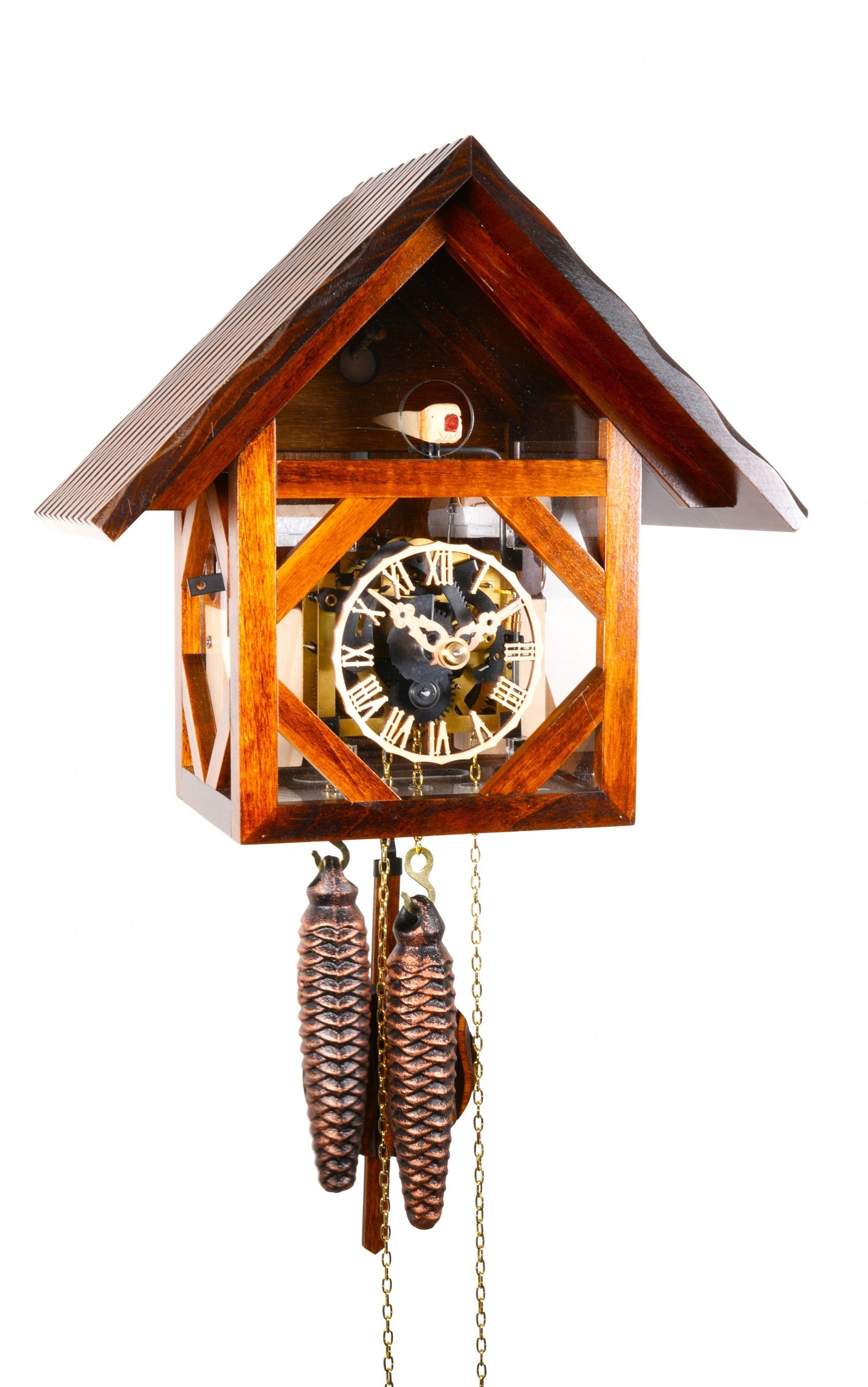 Orologio a cucù da parete meccanico in legno noce con telaio a vista, tetto a due spioventi, quadrante con numeri romani, meccanismo visibile, pendolo e due pesi a forma di pigna appesi alle catene